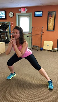 woman doing lateral lunge