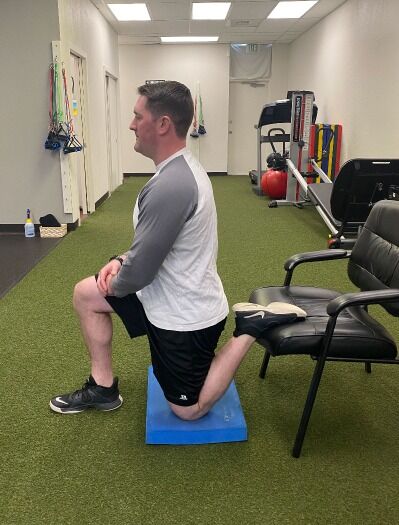 chair assisted kneeling hip flexor stretch